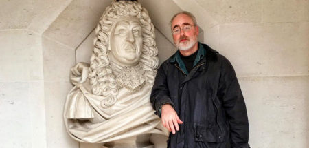 Dave leaning on a bust of Samuel Pepys